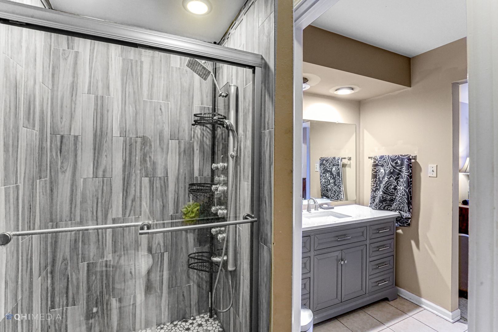 2930 Paris Road Olympia Fields, IL 60461 - Photo 23 of 27 a bathroom with a double vanity sink and mirror