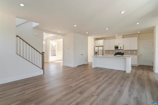 a view of kitchen with wooden floor and window