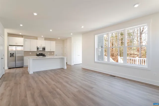 a view of kitchen with wooden floor and large window