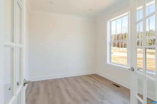 a view of an empty room and window