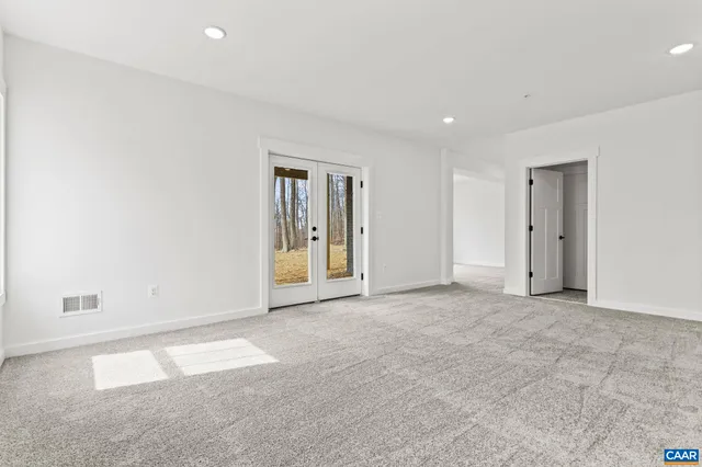 an empty room with entrance and door