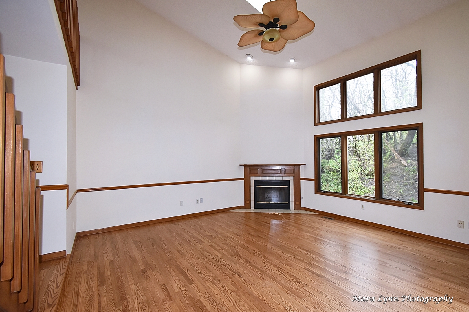 112 Sumac Court St. Charles, IL 60174 - Photo 11 of 37 a view of an empty room with a window and wooden floor