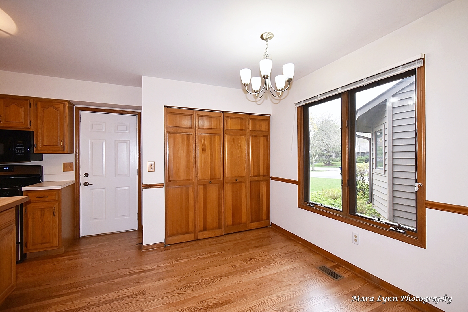 112 Sumac Court St. Charles, IL 60174 - Photo 15 of 37 wooden floor in an empty room with a window