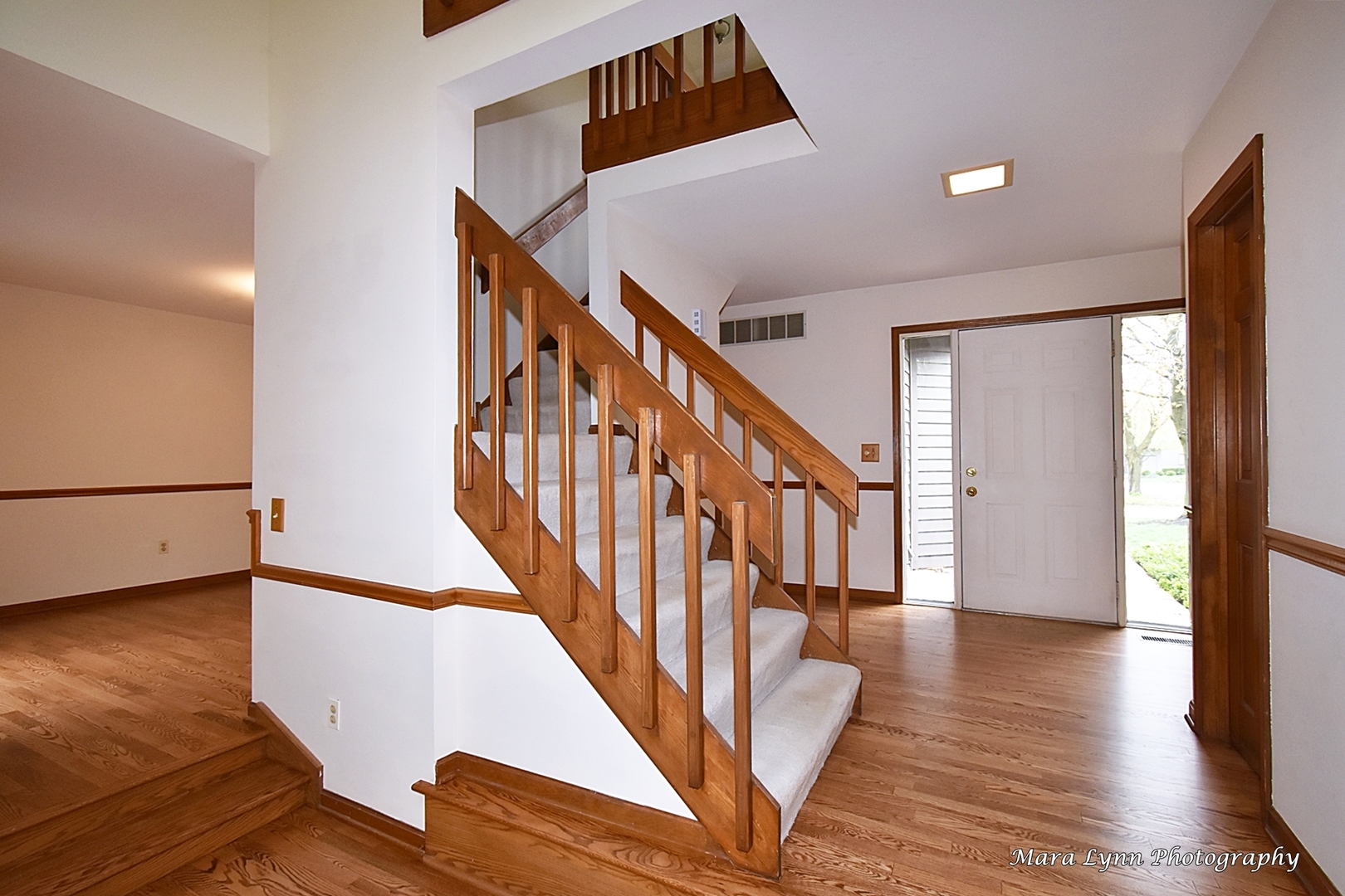 112 Sumac Court St. Charles, IL 60174 - Photo 7 of 37 a view of entryway with wooden floor