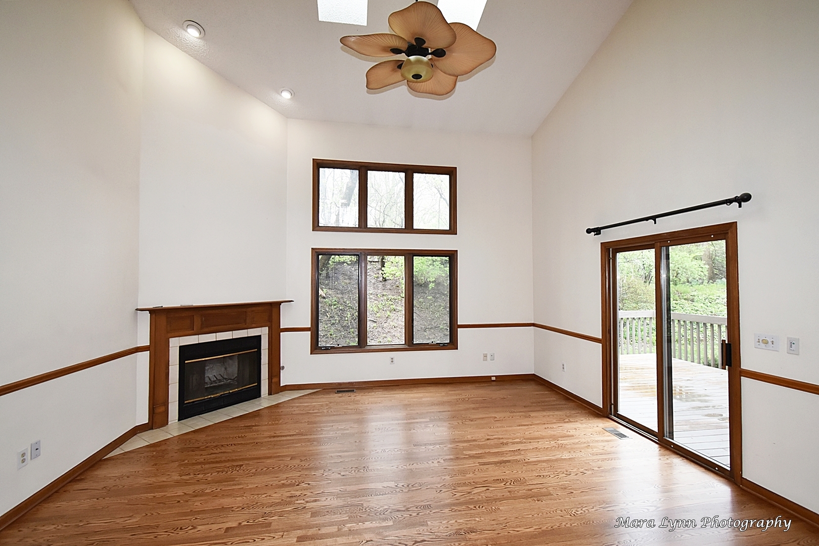 112 Sumac Court St. Charles, IL 60174 - Photo 9 of 37 a view of an empty room with a window and wooden floor