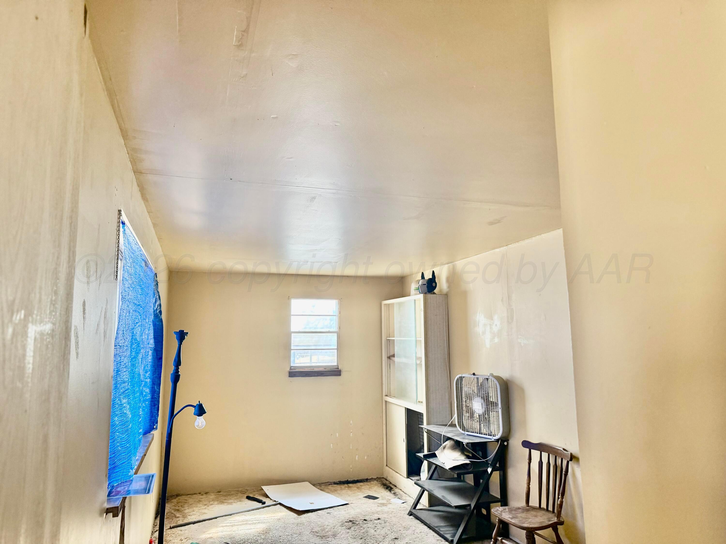1518 South Williams Street Amarillo, TX 79102 - Photo 5 of 13 a bedroom with a bed and a window