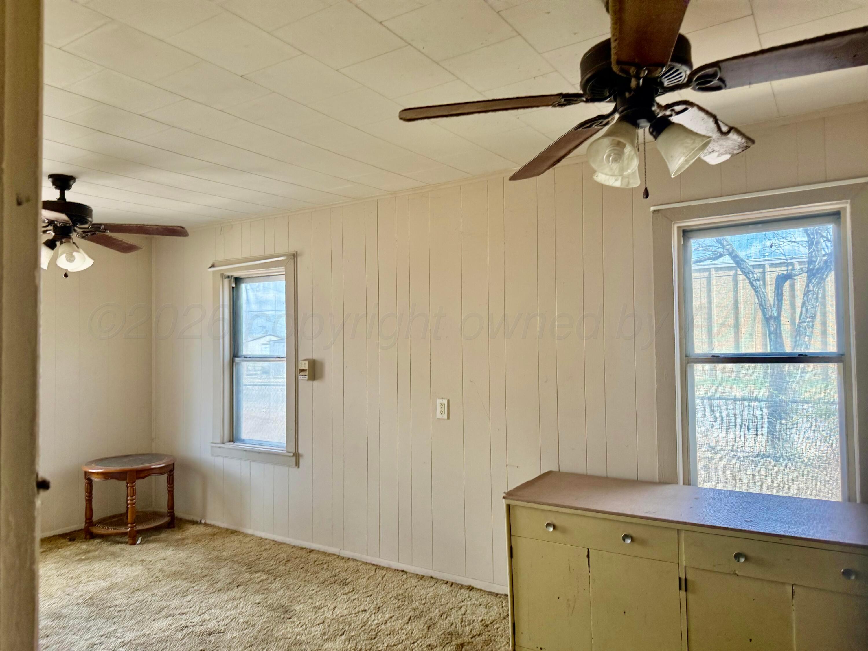 1518 South Williams Street Amarillo, TX 79102 - Photo 8 of 13 a bedroom with a bed and a window