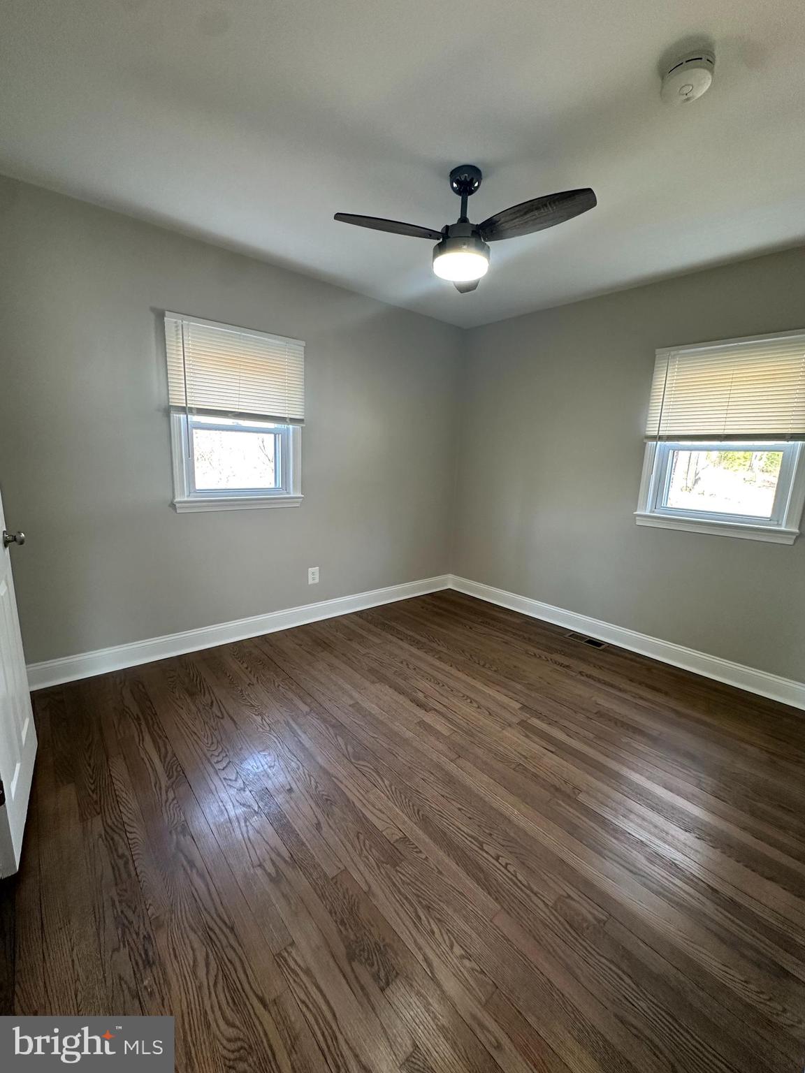11160 Tippett Road Clinton, MD 20735 - Photo 15 of 37 wooden floor in an empty room with a window