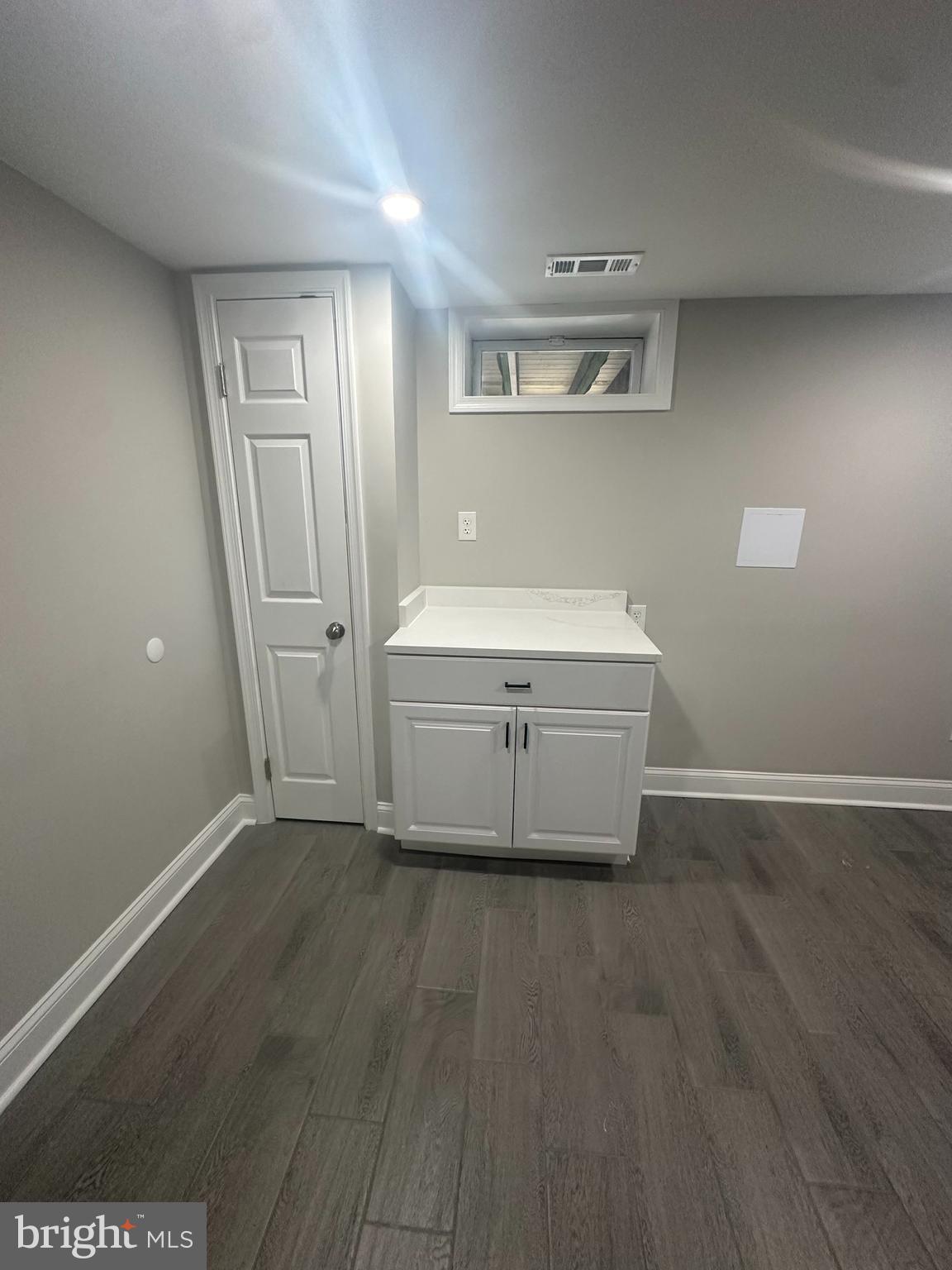 11160 Tippett Road Clinton, MD 20735 - Photo 26 of 37 a room with wooden floor and window