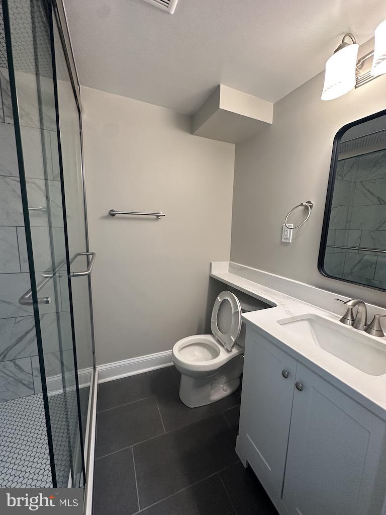 11160 Tippett Road Clinton, MD 20735 - Photo 32 of 37 a bathroom with a sink and a mirror