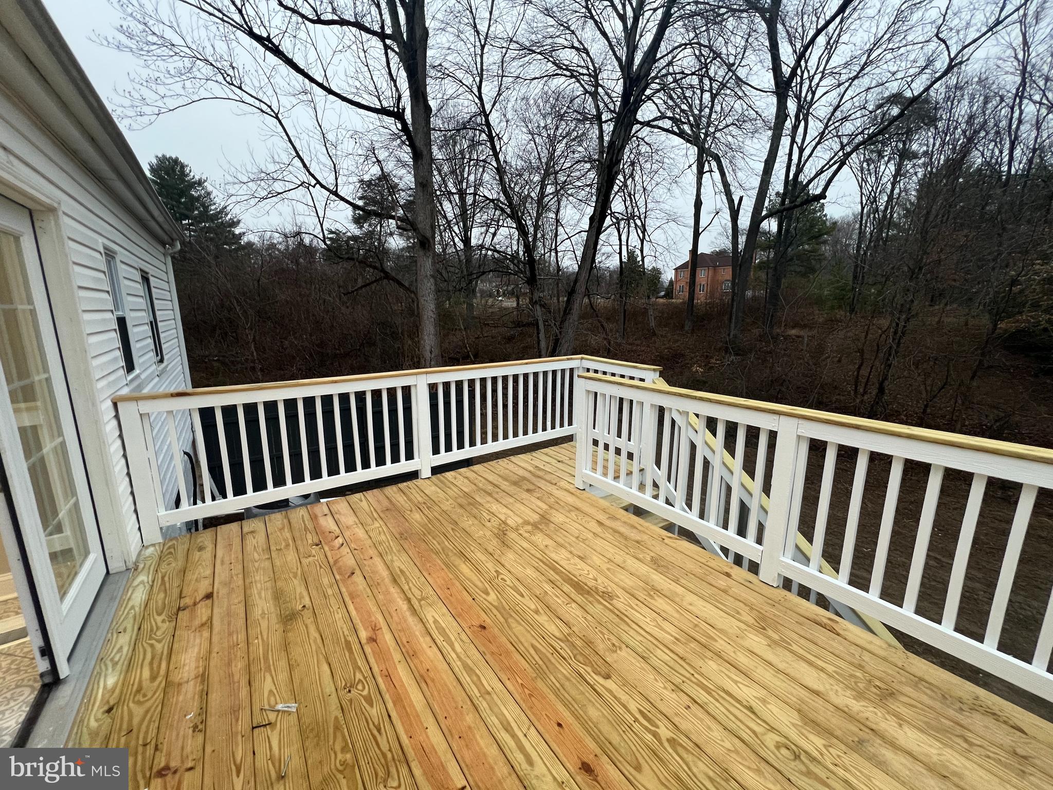 11160 Tippett Road Clinton, MD 20735 - Photo 34 of 37 a view of balcony with wooden floor and fence