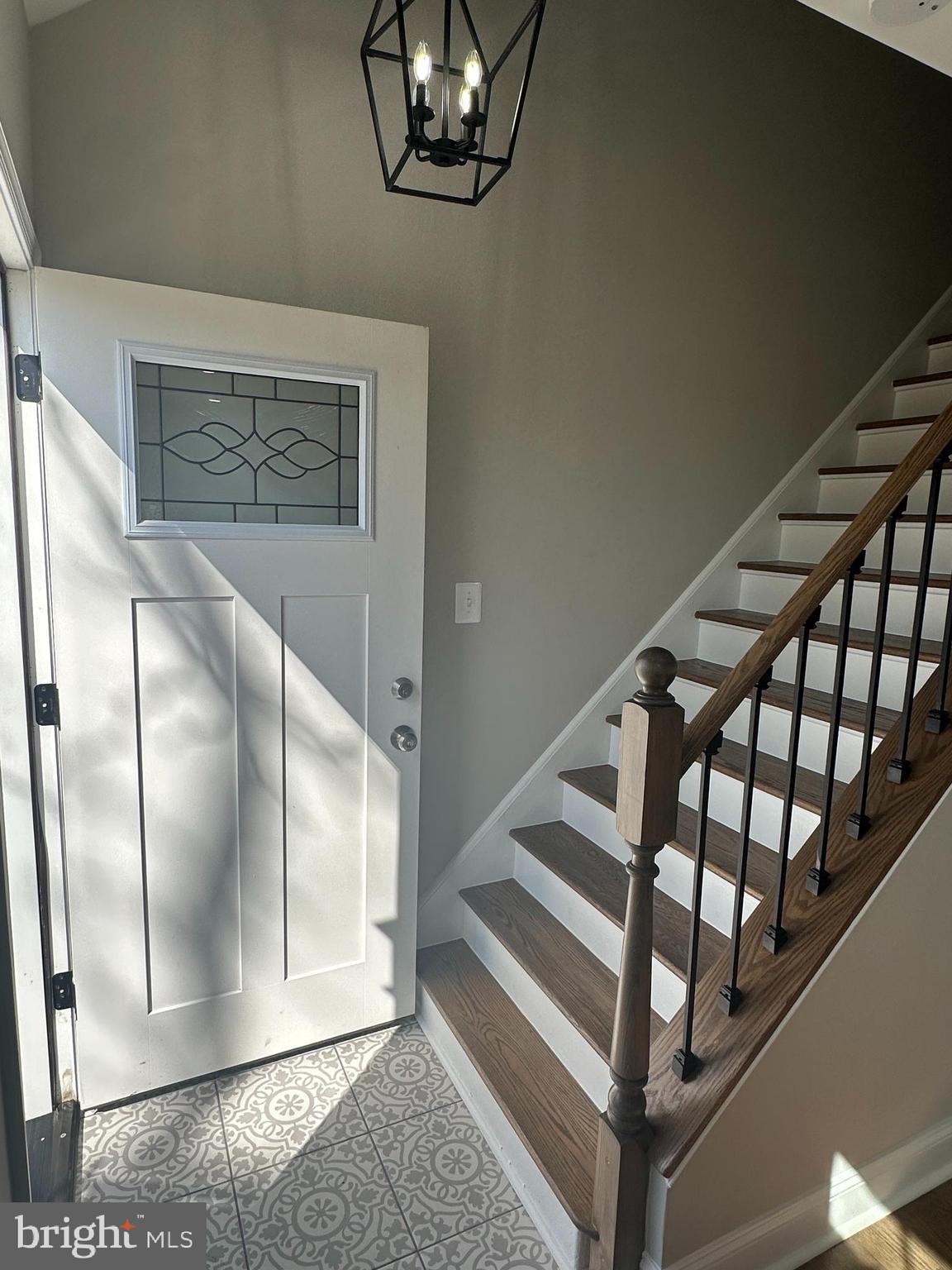 11160 Tippett Road Clinton, MD 20735 - Photo 4 of 37 a view of staircase with white walls and a window