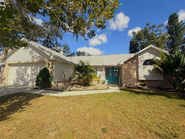 a view of a house with a yard