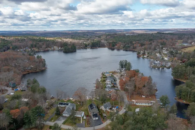 a view of a lake with beach and city view