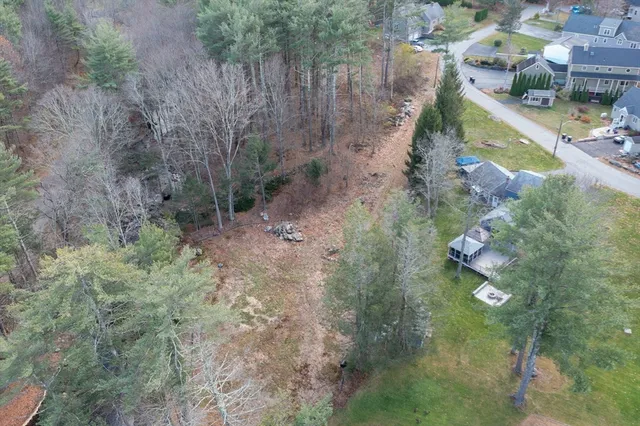 a view of a lake with beach and city view