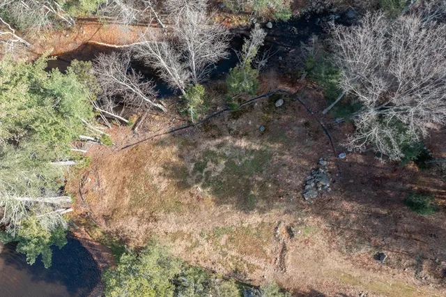 a view of a city street both side of river