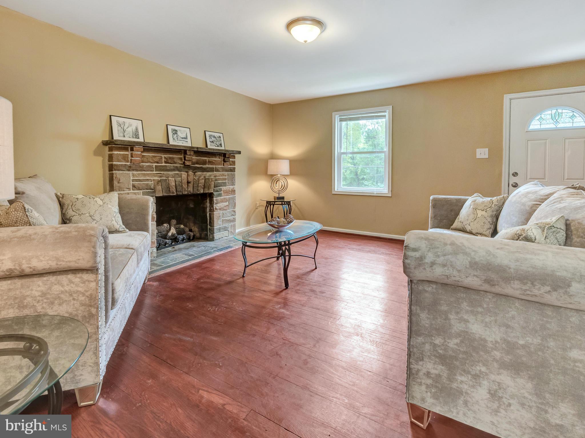 5812 Shookstown Road Frederick, MD 21702 - Photo 1 of 31 a living room with furniture and a fireplace