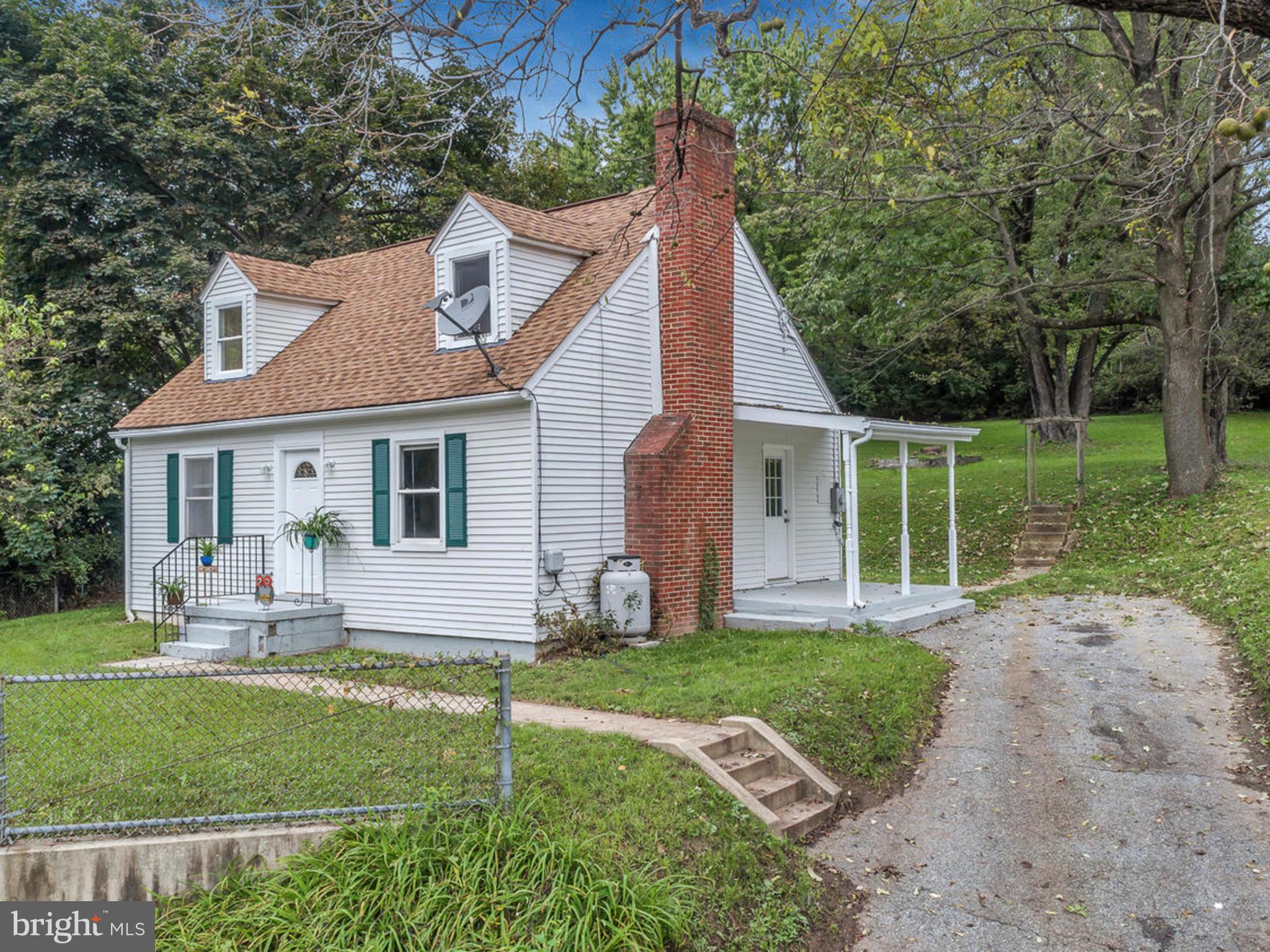 5812 Shookstown Road Frederick, MD 21702 - Photo 2 of 31 a front view of a house with a yard and porch