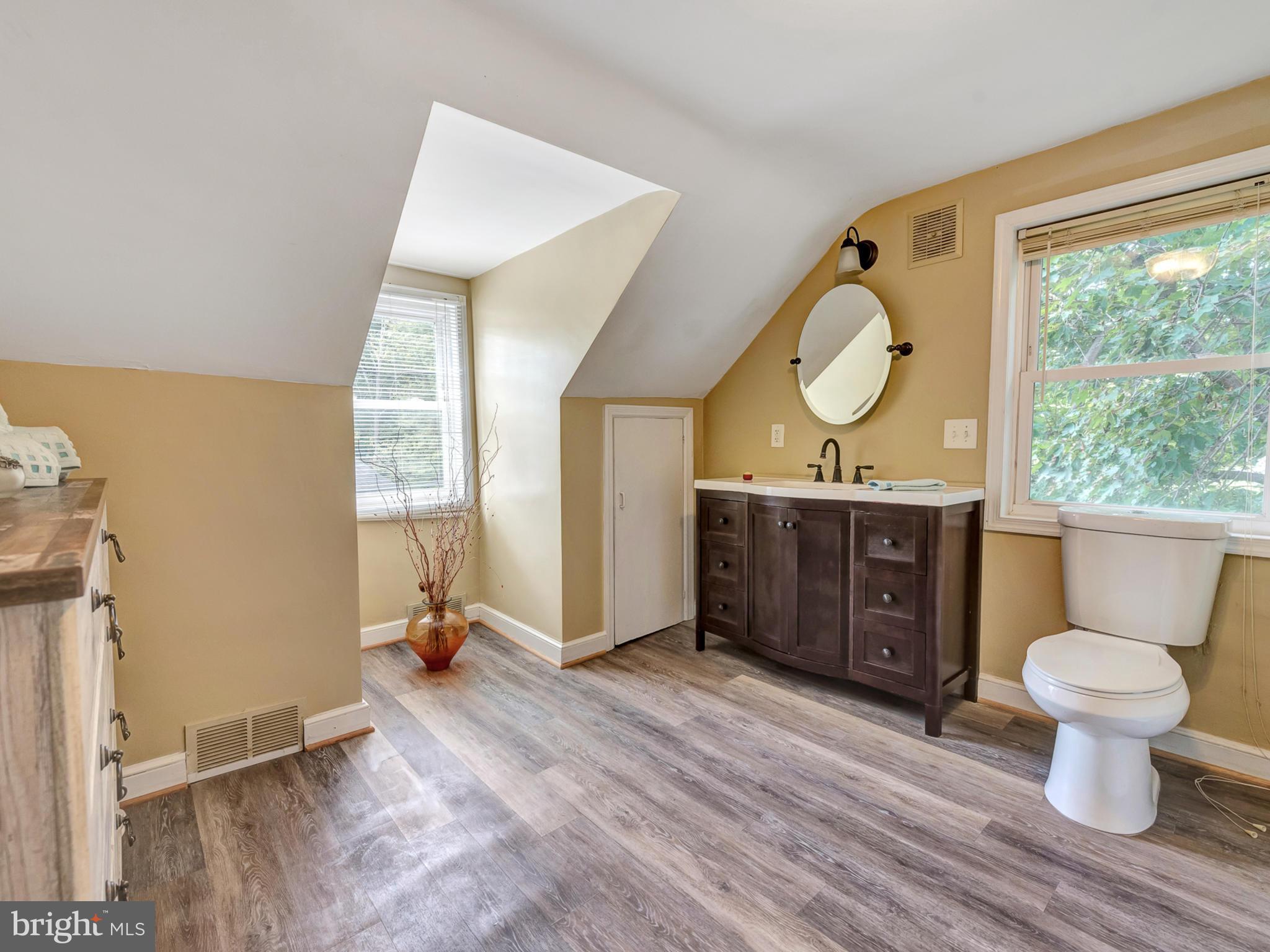 5812 Shookstown Road Frederick, MD 21702 - Photo 15 of 31 a view of a bathroom with a toilet sink and a mirror