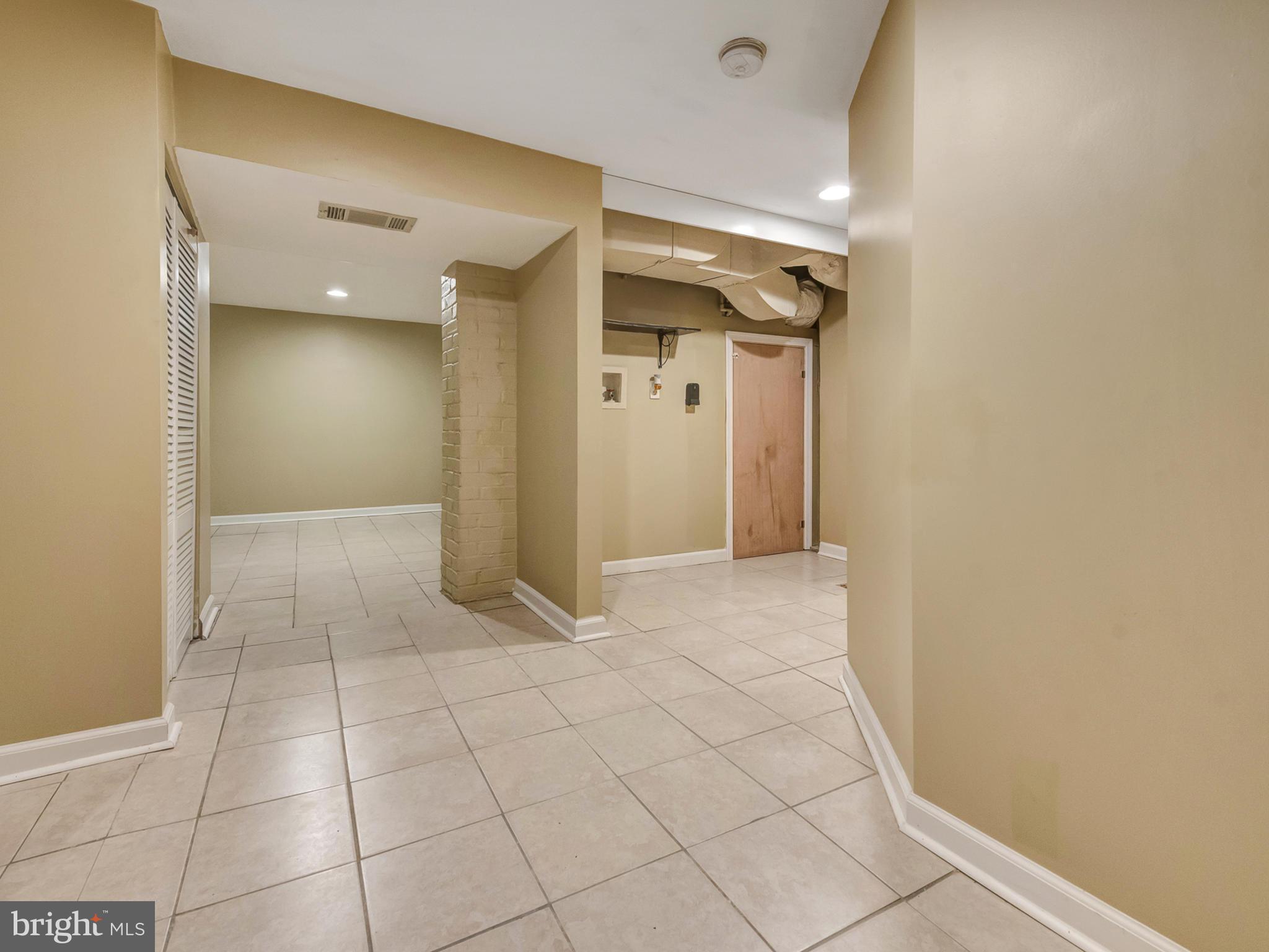 5812 Shookstown Road Frederick, MD 21702 - Photo 23 of 31 a view of hallway with a window and a mirror