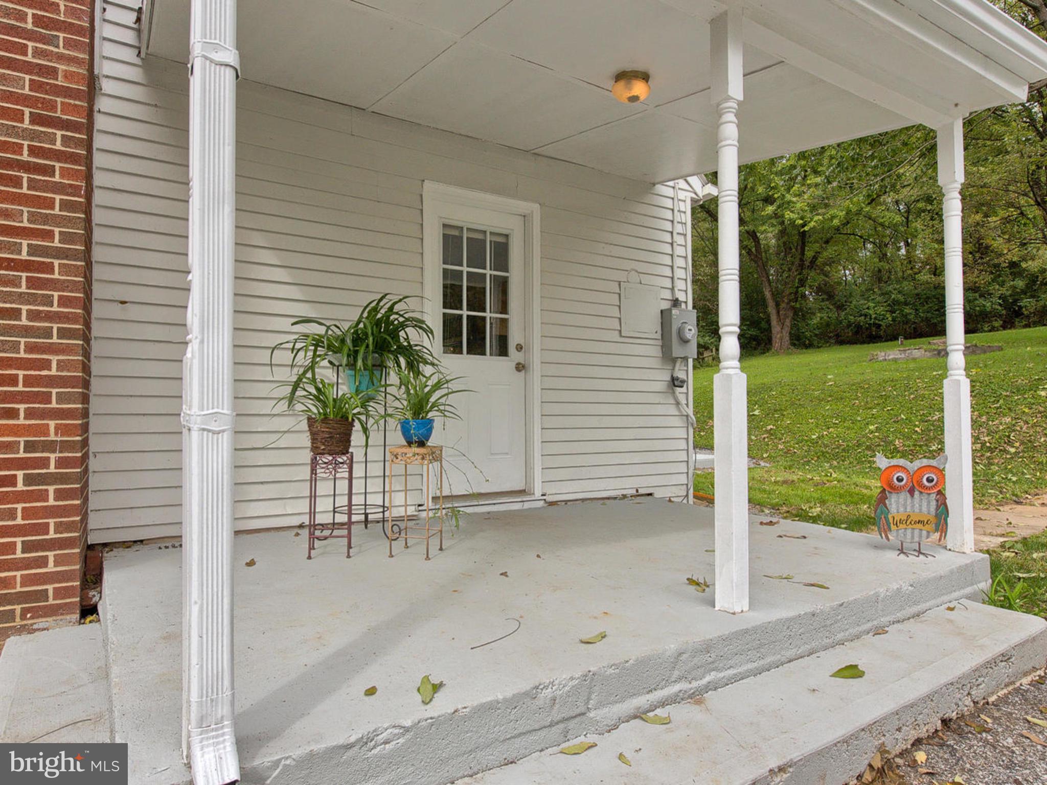 5812 Shookstown Road Frederick, MD 21702 - Photo 26 of 31 a view of a porch with a potted plant