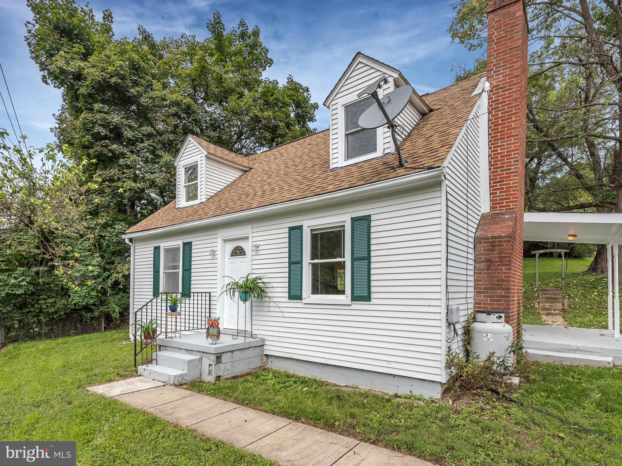 5812 Shookstown Road Frederick, MD 21702 - Photo 30 of 31 a view of a house with backyard and a garden
