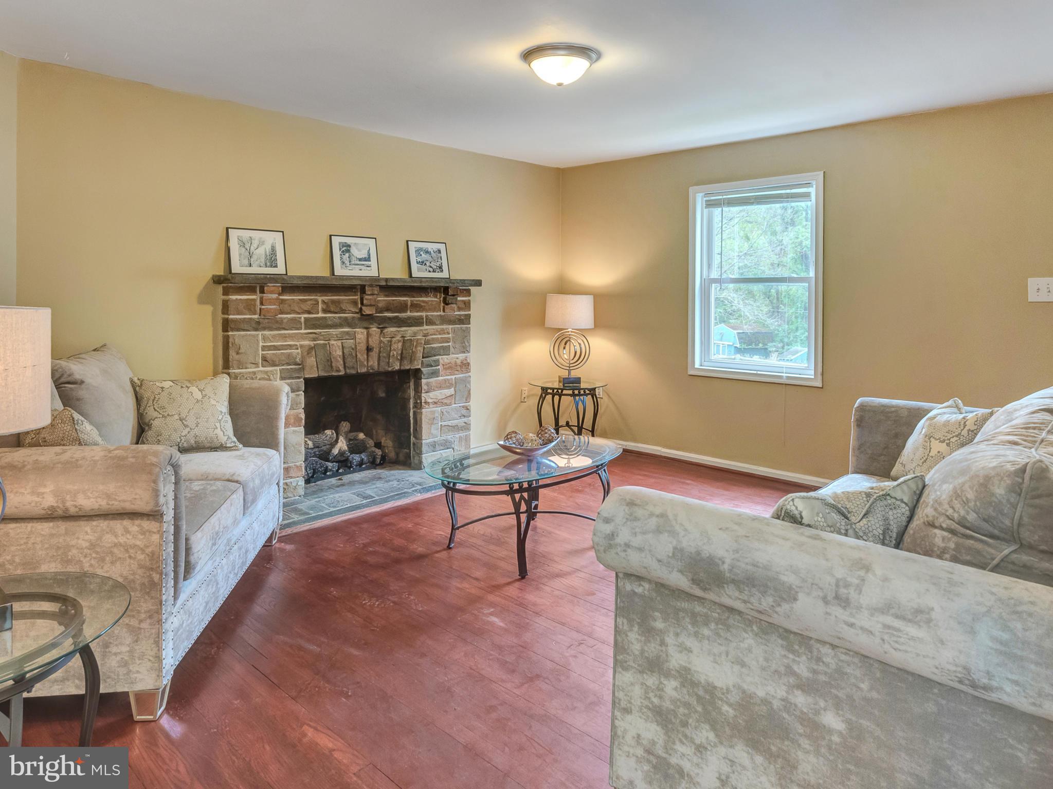 5812 Shookstown Road Frederick, MD 21702 - Photo 4 of 31 a living room with furniture and a fireplace