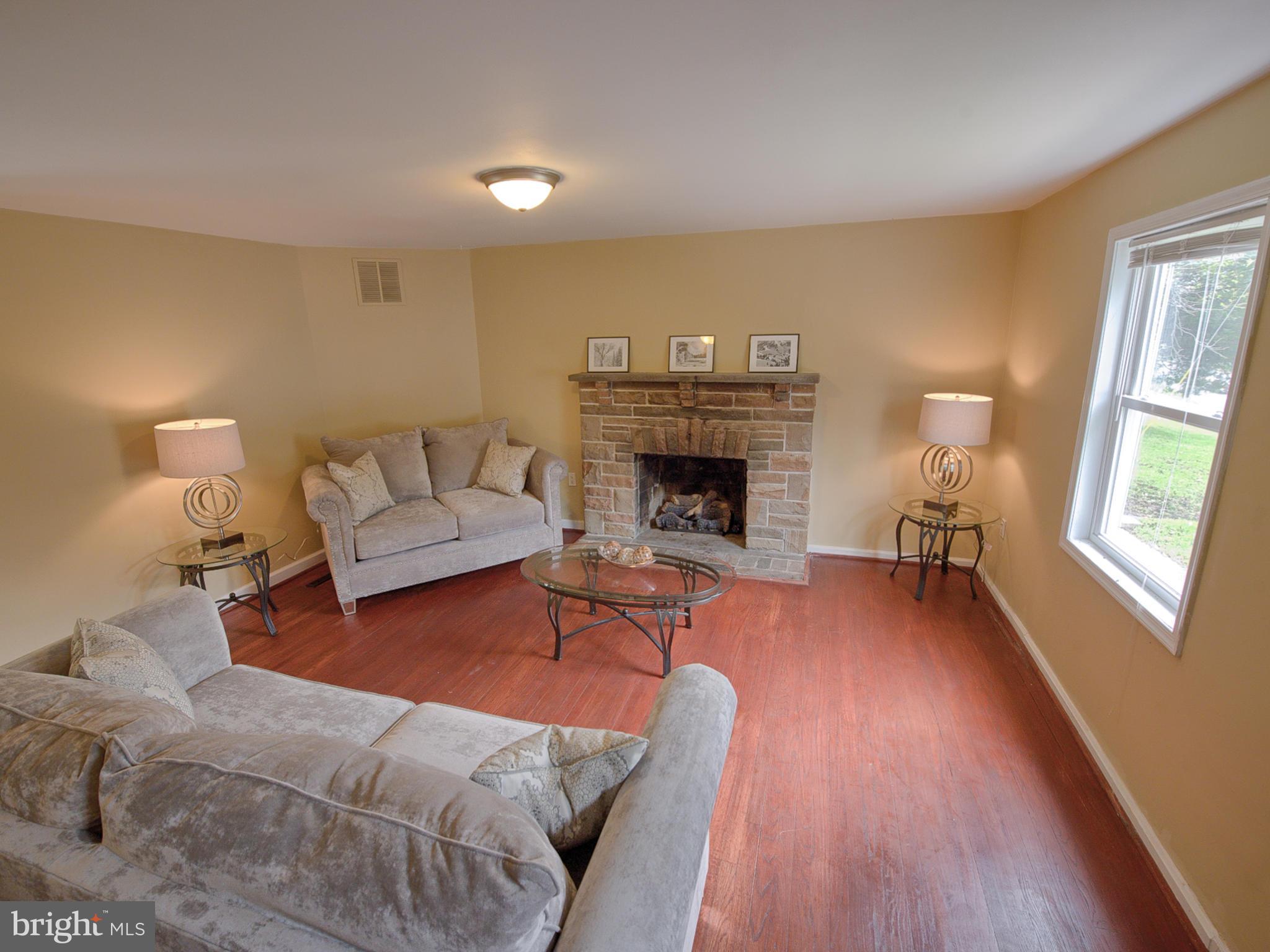 5812 Shookstown Road Frederick, MD 21702 - Photo 5 of 31 a living room with furniture and a fireplace