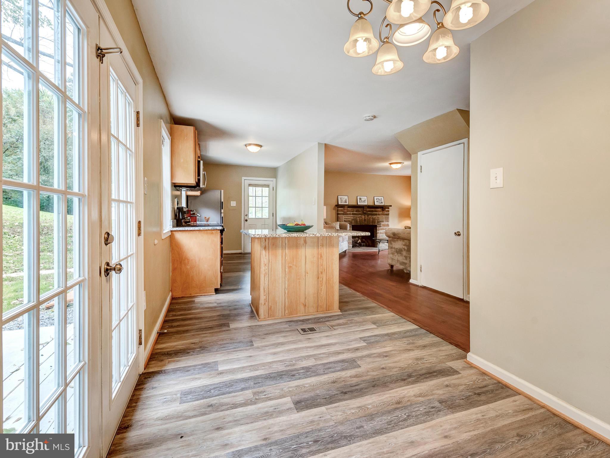 5812 Shookstown Road Frederick, MD 21702 - Photo 10 of 31 a view of a kitchen with wooden floor