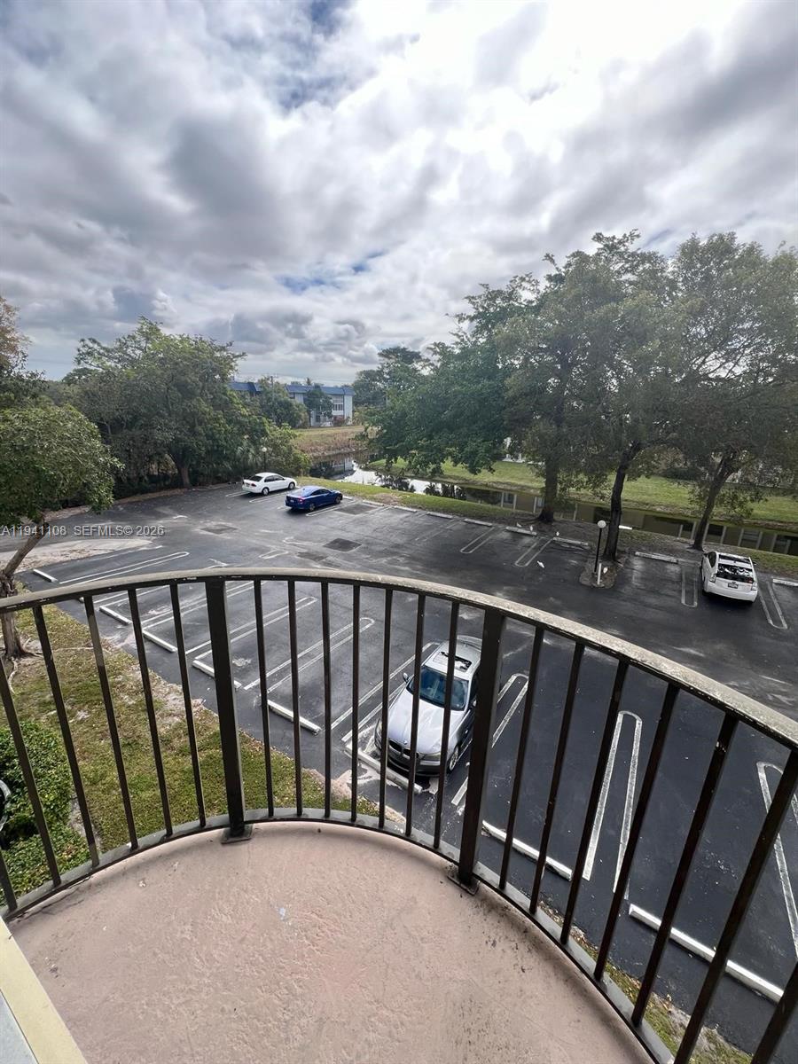 2701 Riverside Drive, Unit 308B Coral Springs, FL 33065 - Photo 4 of 9 a balcony with street view