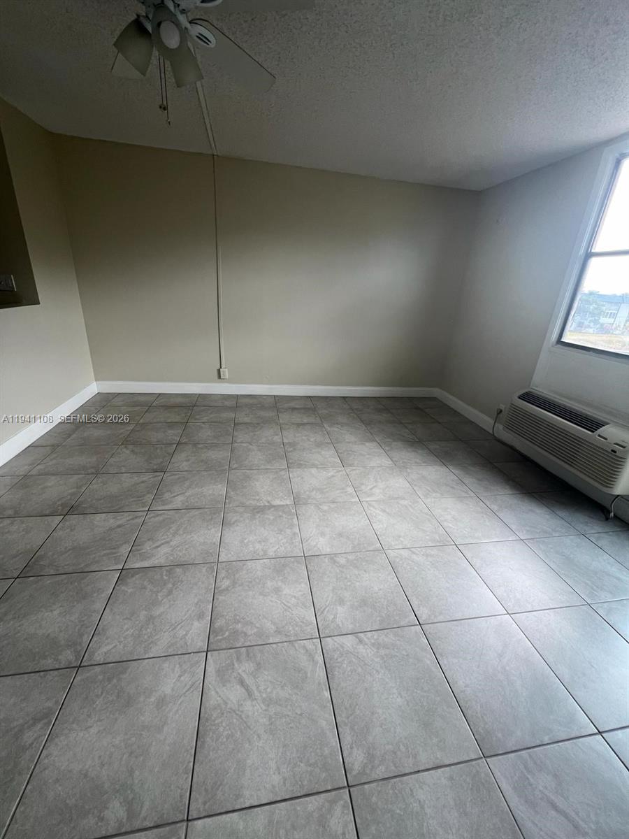 2701 Riverside Drive, Unit 308B Coral Springs, FL 33065 - Photo 7 of 9 a view of an empty room with a window