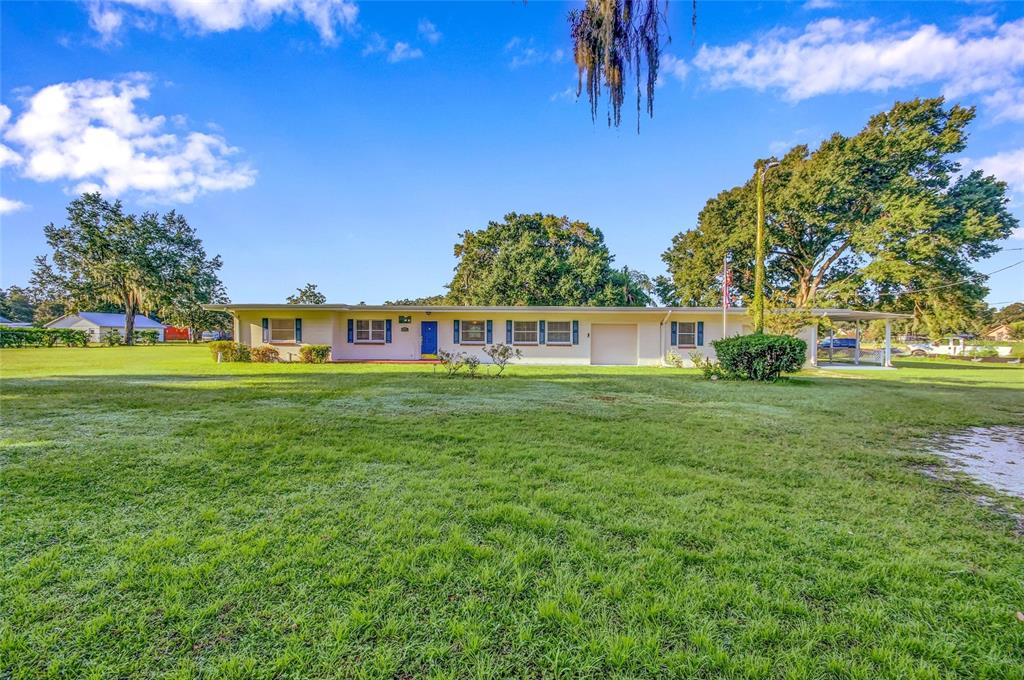 4601 Durant Road Valrico, FL 33596 - Photo 1 of 1 a view of a house with a big yard