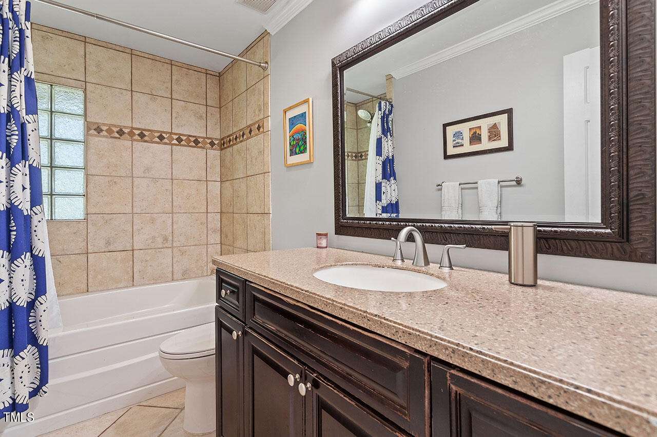 315 Golf Course Drive Raleigh, NC 27610 - Photo 29 of 44 a bathroom with a sink and a bathtub