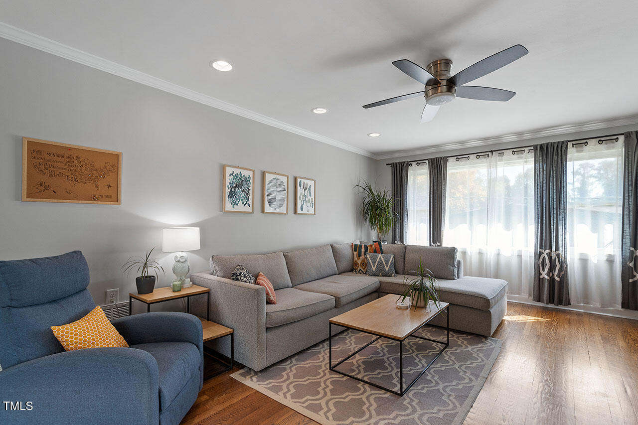 315 Golf Course Drive Raleigh, NC 27610 - Photo 3 of 44 a living room with furniture and a large window