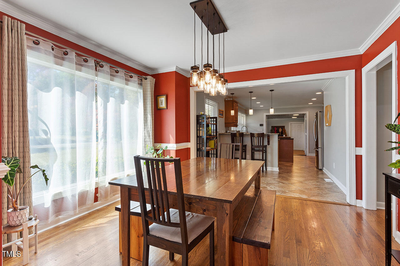 315 Golf Course Drive Raleigh, NC 27610 - Photo 8 of 44 a view of a dining room with furniture and window