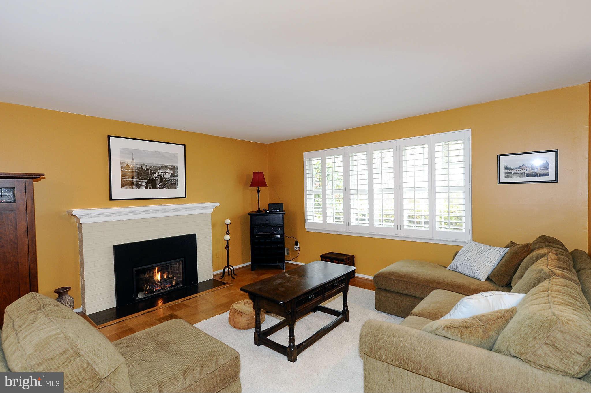 5411 Inverchapel Road Springfield, VA 22151 - Photo 1 of 22 a living room with furniture and a fireplace