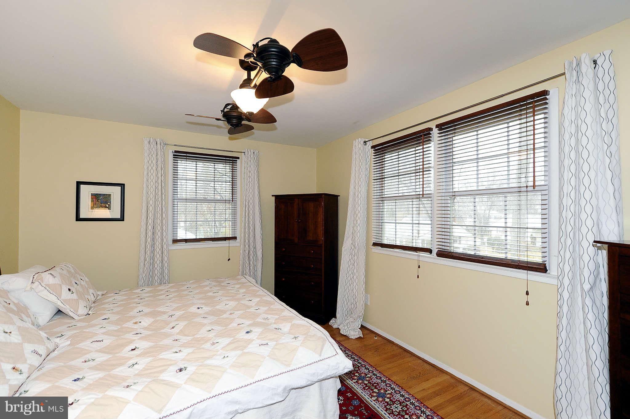5411 Inverchapel Road Springfield, VA 22151 - Photo 11 of 22 a bedroom with a bed cabinets and window