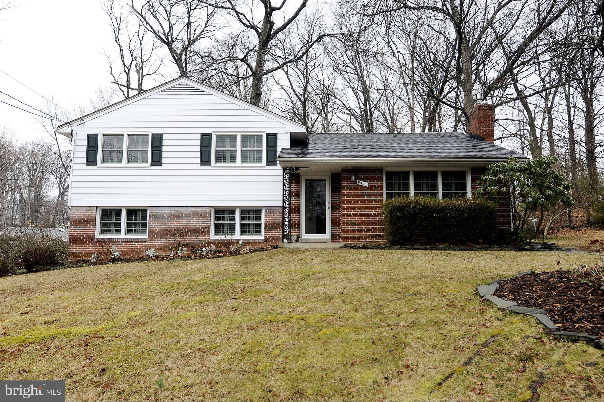 5411 Inverchapel Road Springfield, VA 22151 - Photo 22 of 22 a front view of a house with a garden