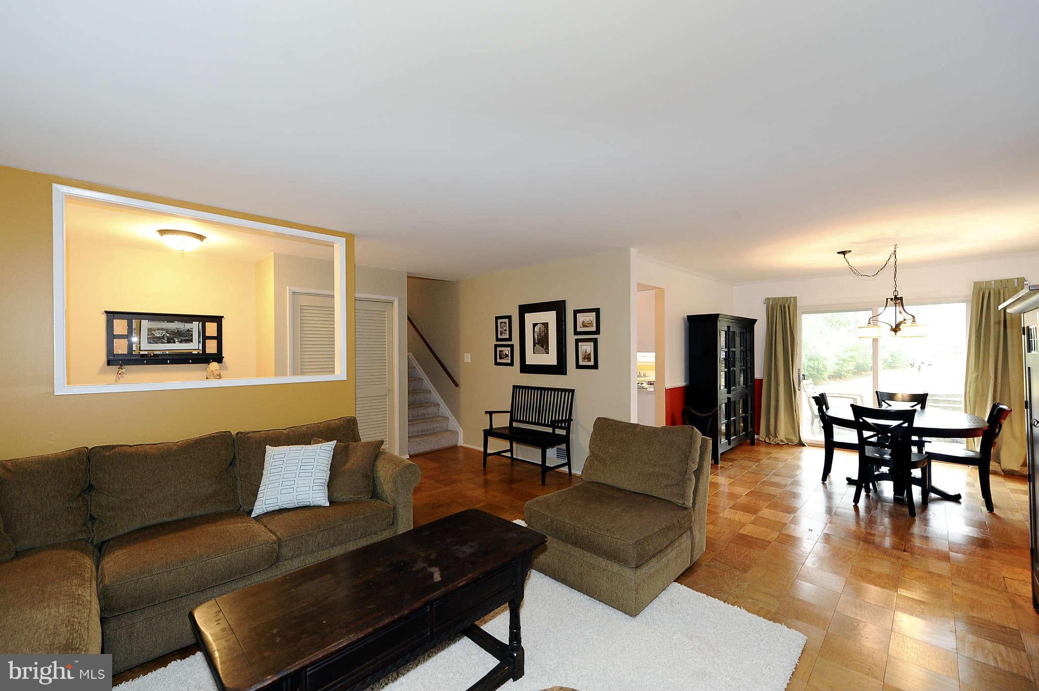 5411 Inverchapel Road Springfield, VA 22151 - Photo 6 of 22 a living room with furniture and a dining table with wooden floor