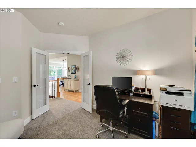 a workspace with furniture and kitchen