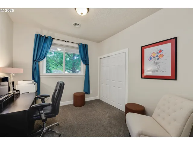 a view of a livingroom with furniture and windows