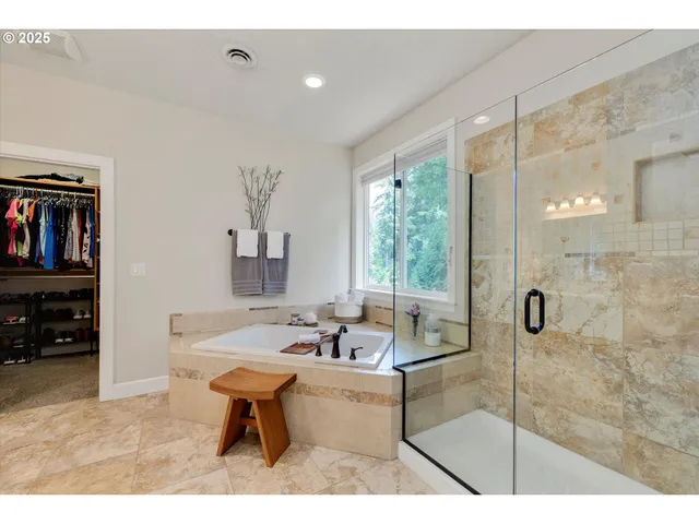 a living room with furniture a flat screen tv and a window