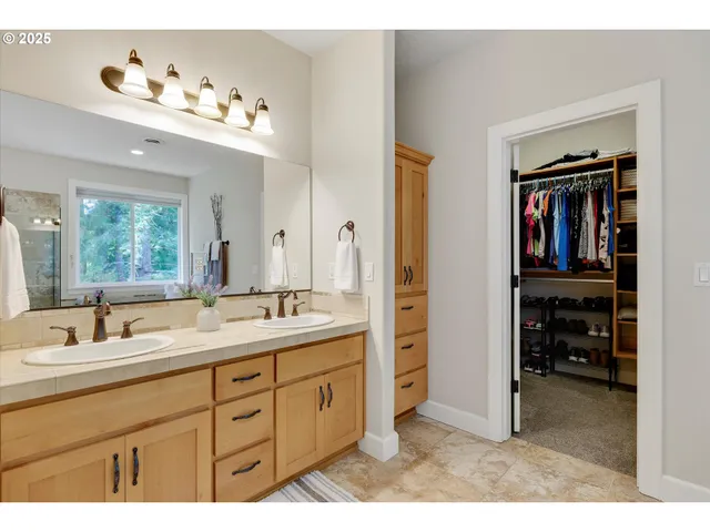 a bathroom with a sink vanity and a mirror