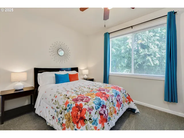 a bedroom with a bed and window