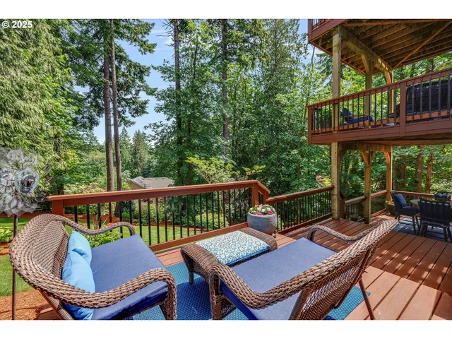 a view of a deck with a table and chairs