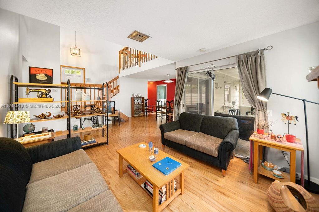 14914 Southwest 142nd Place Miami, FL 33186 - Photo 13 of 27 a living room with furniture and wooden floor