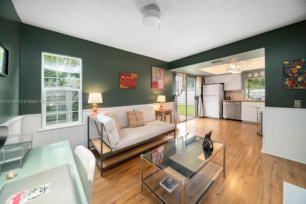 14914 Southwest 142nd Place Miami, FL 33186 - Photo 20 of 27 a living room with furniture and a large window