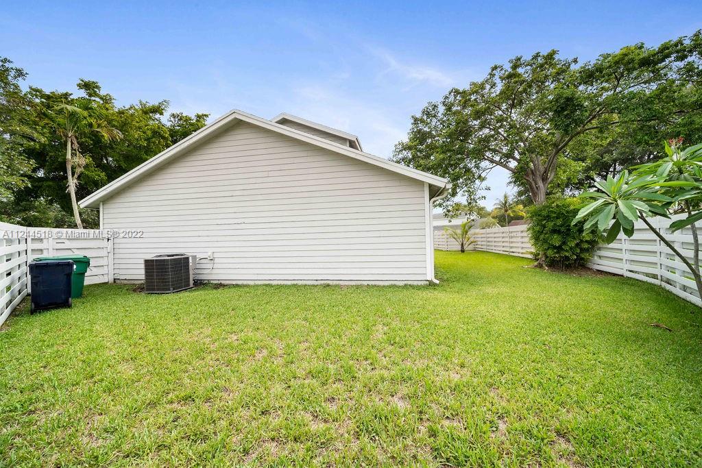 14914 Southwest 142nd Place Miami, FL 33186 - Photo 22 of 27 a view of a house with a yard