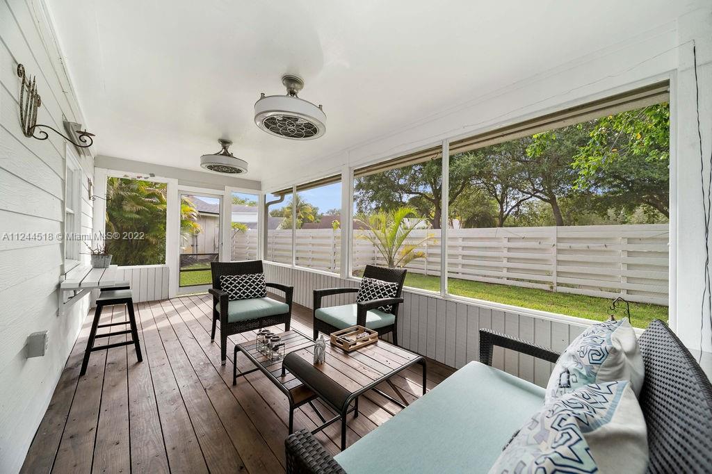 14914 Southwest 142nd Place Miami, FL 33186 - Photo 26 of 27 a living room with furniture and a large window