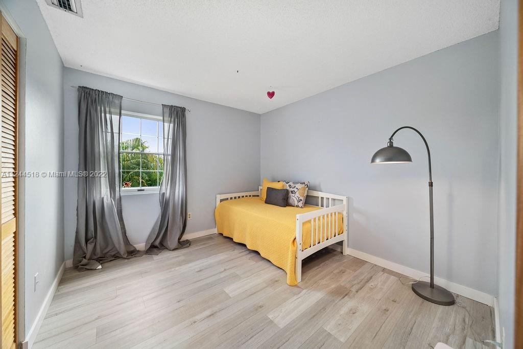 14914 Southwest 142nd Place Miami, FL 33186 - Photo 6 of 27 a room with a bed and a window